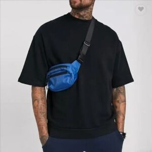 Combine a fashionable sling bag with an oversized t shirt